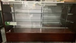 Cherry Wooden 70 Inch Half Vision Display Showcase With Rear Storage And Locks Used. Price: $200.00.