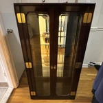 American Furn. Co. Glass Display Cabinet Brown 3 Shelves Model 7796-778 Used. Price: $1150.00.